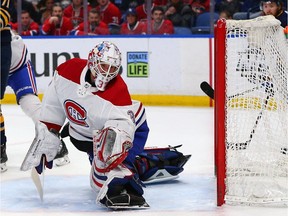 Canadiens' Antti Niemi  makes a glove save against the Sabres during the second period at KeyBank Center on Friday, March 23, 2018, in Buffalo.