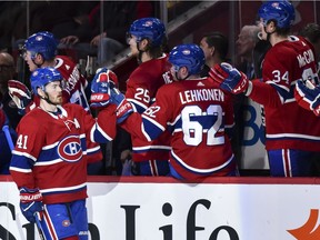 MONTREAL, QC - MARCH 26:  Paul Byron #41 of the Montreal Canadiens celebrates his first period goal with teammates on the bench against the Detroit Red Wings during the NHL game at the Bell Centre on March 26, 2018 in Montreal, Quebec, Canada.