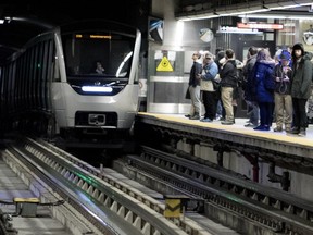 Métro riders wait on the platform at the Montmorency station in February 2018.