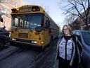 Malkie Farkas, a mother, teacher and member of the community as a school bus passes by in Outremont. 