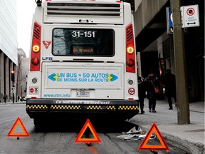 A broken down STM bus blocks a section of University Street in Montreal on Tuesday January 17, 2017.