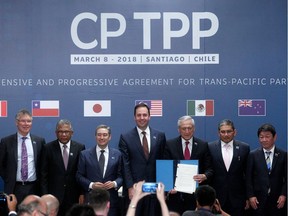 Canada's International Trade Minister François-Philippe Champagne (third from left) and Australia's Trade Minister Steven Ciobo (fourth from left) along with theircounterparts from nine other nations, signed the rebranded Comprehensive and Progressive Agreement for Trans-Pacific Partnership (CPTPP) in Santiago, on March 8, 2018.