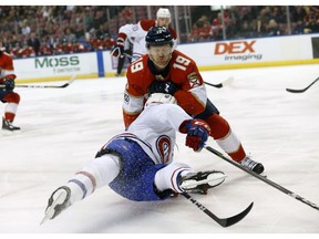 Canadiens winger Daniel Carr Florida Panthers defenceman Mike Matheson (19) collide during first period Thursday night in Sunrise, Fla.