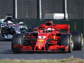 Ferrari driver Sebastian Vettel of Germany steers his car ahead of Mercedes driver Lewis Hamilton of Britain during the Australian Formula One Grand Prix in Melbourne, Australia, Sunday, March 25, 2018.