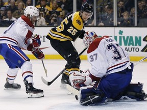 Montreal Canadiens' Antti Niemi blocks a shot by Boston Bruins' Brandon Carlo in overtime in Boston on Saturday, March 3, 2018. The Bruins won 2-1.