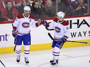 Canadiens' Max Pacioretty, left, and Paul Byron both see a significant drop in their production when they play on the road.