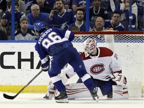 Tampa Bay Lightning right wing Nikita Kucherov, (86) of Russia, beats Montreal Canadiens goaltender Antti Niemi, of Finland, for a goal during a shootout in an NHL hockey game Saturday, March 10, 2018, in Tampa, Fla. The Lightning won the game 3-2.