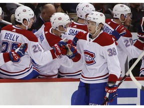 Montreal Canadiens' Nikita Scherbak (38) is congratulated after his second-period goal against the Pittsburgh Penguins in Pittsburgh on March 21, 2018.