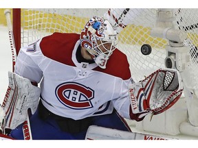 Canadiens goaltender Antti Niemi gloves a loose puck against the Penguins in Pittsburgh on Saturday, March 31, 2018.