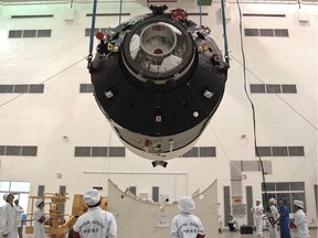 Researchers install China's first space station module, Tiangong-1, at the Jiuquan Satellite Launch Centre in northwest China's Gansu Province prior to its launch on Sept. 29, 2011.