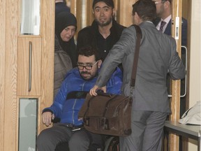 Ayman Derbali, who was injured in the 2017 shootings, leaves the courthouse in Quebec City where Alexandre Bissonnette pleaded guilty on Wednesday.