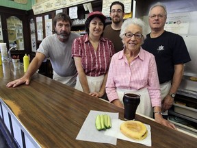 The staff at Wilensky's in Montreal, Wednesday, Oct. 26, 2011 (from left):  Asher Wilensky and Sharon Wilensky, Scott Druzin, Ruth Wilensky and Paul Scheffer.  On the counter is a Wilensky's Special sandwich with a side of pickles and a cherry cola.