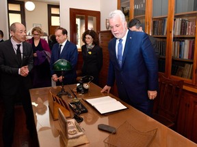 Quebec Premier Philippe Couillard commented on a review of doctor salaries before ending his trade mission to France. (Gerard Julien/Pool Photo via AP)