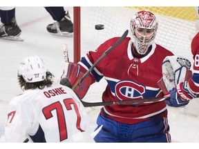 Washington Capitals' T.J. Oshie scores against Canadiens goaltender Carey Price during third period NHL hockey action in Montreal on Saturday, March 24, 2018.