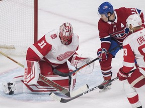 Montreal Canadiens right wing Brendan Gallagher (11) moves in on Detroit Red Wings goaltender Jared Coreau (31) as defenceman Trevor Daley (83) defends during third period NHL hockey action in Montreal, Monday, March 26, 2018.