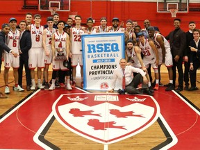 McGill Redmen basketball team poses with provincial championship banner for 2017-18 season after beating the Concordia Stingers 98-79 at McGill's Love Competition Hall of March 3, 2018.