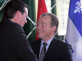 André Bachand (right), the former PC MP for the Eastern Townships riding of Richmond-Arthabaska, shakes hands with MP Christian Paradis in 2008.