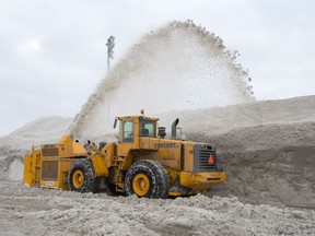 Wednesday, February 14, 2018 in Montreal: A snowblower piles snow at the city's newest dump at Blue Bonnets