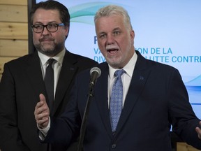 "Immigrants can help ensure our economic development in regions across Quebec," writes Viau MNA David Heurtel, seen here with Premier Philippe Couillard.