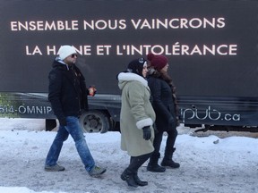 People arrive for a funeral service for three of the six victims of the Quebec City mosque shooting at Maurice Richard Arena in Montreal, Thursday, February 2, 2017.