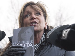 Quebec nurse union (FIQ) president Nancy Bedard holds a copy of a book they published as she responds to reporters questions before meeting with Quebec Health Minister Gaetan Barrette Tuesday, February 6, 2018 in Quebec City.