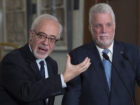 The Liberals have made a number of spending promises in recent weeks, but "there will be plenty of good things left to announce" in Tuesday's budget, says Finance Minister Carlos Leitão, left, with Premier Philippe Couillard.
