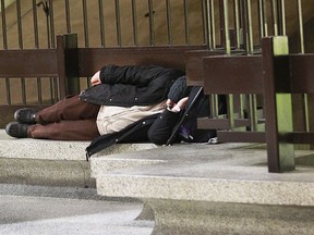 A homeless sleeps on a bench at Bonaventure métro.