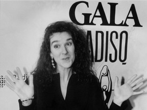 Singer Celine Dion holds up her hands after refusing her Felix award for Best Anglophone Artist at the Quebec Music Industry Awards (ADISQ) ceremonies in Montreal, Oct. 21, 1990. Twenty-five years ago, a breathtakingly talented Quebec singer made her introduction to most of the English-speaking world. With the release of 1990's "Unison" - her first album in English, her stunning 15th overall - Celine Dion pounded her heart and stole ours.