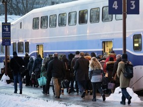 People line the platform to board a St-Jérôme bound commuter train at the Lucien l'Allier station in January.