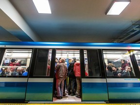 Passengers wait inside the new AZUR metro train as it leaves Berri-UQAM station.