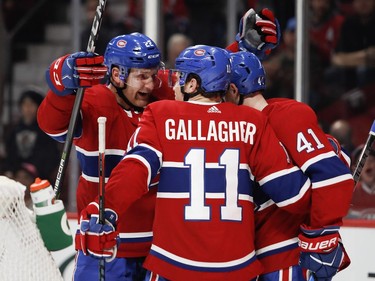 Montreal Canadiens defenceman Karl Alzner, left to right, Montreal Canadiens right wing Brendan Gallagher and Montreal Canadiens left wing Paul Byron celebrate Byron's goal during NHL action against the Winnipeg Jets in Montreal on Tuesday April 3, 2018.