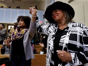 People clap and sing along as Claire Jean-Charles sang Precious Lord during a memorial to mark 50th anniversary of the assassination of Martin Luther King Jr. The service was held at the Union United Church in Montreal oLittle Burgundy.