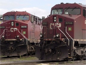 Canadian Pacific Railway locomotives sit in a rail yard in Montreal. The union representing some 3,000 conductors and locomotive engineers at Canadian Pacific Railway Ltd. says the workers have voted to authorize a strike.