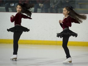 Beatrice Jette (left) and Angeline Lee skate during the Club de patinage Hudson Rigaud St-Lazare Skating Club Broadway themed show in St-Lazare on Sunday.