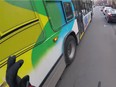 A video posted to YouTube shows an STM bus passing close to a cyclist riding along Sherbrooke St. on Wednesday, April 11, 2018. (YouTube)