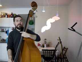 Caspian Kilkelly practices his double bass. "I’ve played the double bass since I was a teenager. I performed on stage for a number of years, but now I mostly work as a sound technician." (Allen McInnis / MONTREAL GAZETTE)