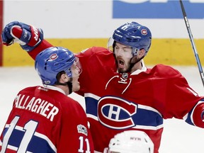 Canadiens forward Paul Byron (right) celebrates with teammate Brendan Gallagher after scoring goal during Game 2 of NHL playoff series against the New York Rangers at the Bell Centre in Montreal on April 14, 2017.
