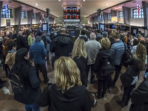 Commuters line up at Central Station on Wednesday. As of Friday, weekend service on the Deux-Montagnes train line will stop.