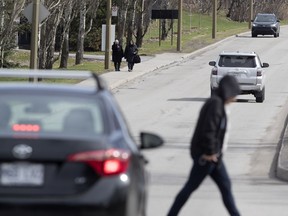 Light traffic flows on Camillien Houde Way on Mount Royal in Montreal on Friday.