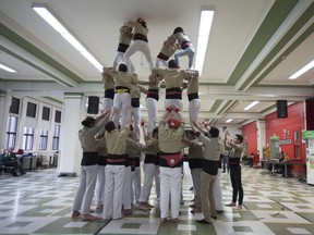 A team of Castellers de Montréal build their human tower in Montreal on April 29, 2018.