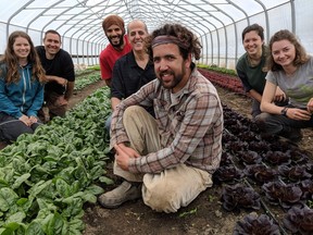 Les Jardins Carya co-founders Ramzy Kassouf, centre in dark shirt, and Alex Flores, left in dark shirt, pose with members of the farming team.