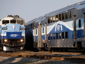 Two commuter trains pass each other at the Montreal West train station in Montreal on Wednesday September 13, 2017.