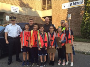 Montreal Police Station 1 Commander Martin Bernier, Constable Giovanni Di Legge, Constable Jean-Pierre Lévis and Constable Simon Allard. Front row left to right: Harrison Brown, Koray Kudeki, Luc Carey, Olivia Duchesne, Meghan Bates and Elsie Laroque. The Grade 6 students helped police warn speeding drivers to slow down in school zones, Sept. 13, 2017.