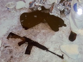 A semi-automatic rifle and guitar case are shown lying in the snow outside the Quebec City mosque in 2017. Alexandre Bissonette brought them to the mosque on the night of the attack.