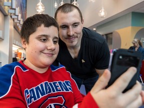 Montreal Canadiens winger Brendan Gallagher poses for a selfie with 12-year-old William Bergeron during a visit to the Shriners Hospitals for Children – Canada in Montreal on Nov. 6, 2017.