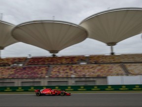Sebastian Vettel, winner of the first two races of the Formula One season, steers his Ferrari during Friday practice in Shanghai ahead of the Chinese Grand Prix.