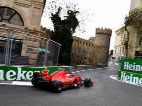 Ferrari's German driver Sebastian Vettel steers his car during the qualifying session for the Formula One Azerbaijan Grand Prix at the Baku City Circuit in Baku on April 28, 2018.