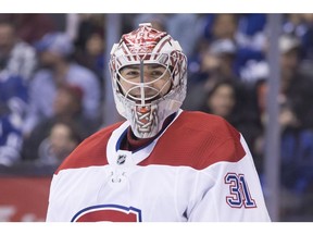 Canadiens goaltender Carey Price smiles after making a save against the Toronto Maple Leafs during second period NHL hockey action in Toronto on Saturday, April 7, 2018.