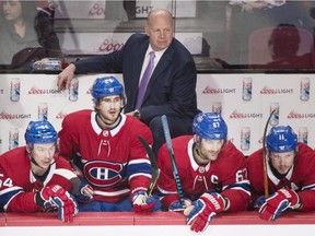 Canadiens head coach Claude Julien looks on from the bench with players Charles Hudon (54), Phillip Danault (24), Max Pacioretty and Brendan Galagher (11) during third period against the San Jose Sharks in Montreal on Jan. 2, 2018.