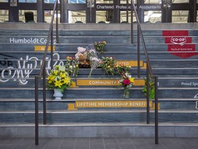 A memorial of flowers and cards sits on the stairs leading into Elgar Petersen Arena, home of the Humboldt Broncos hockey team, in Humboldt, Sask., on Saturday, April 7, 2018. RCMP say 14 people are dead and 14 people were injured Friday after a truck collided with a bus carrying a junior hockey team to a playoff game in northeastern Saskatchewan. Police say there were 28 people including the driver on board the Humboldt Broncos bus when the crash occurred at around 5 p.m. on Highway 35 north of Tisdale.